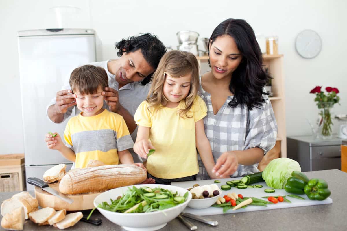 Family cooking a meal together.