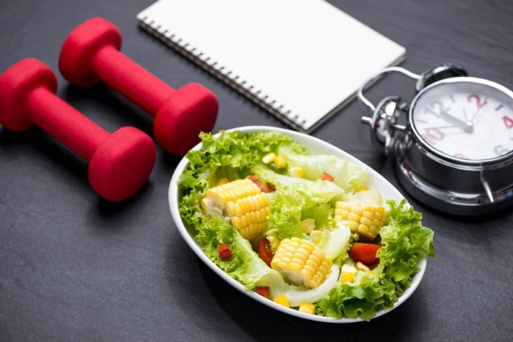 Healthy fitness meal with fresh salad diet concept.