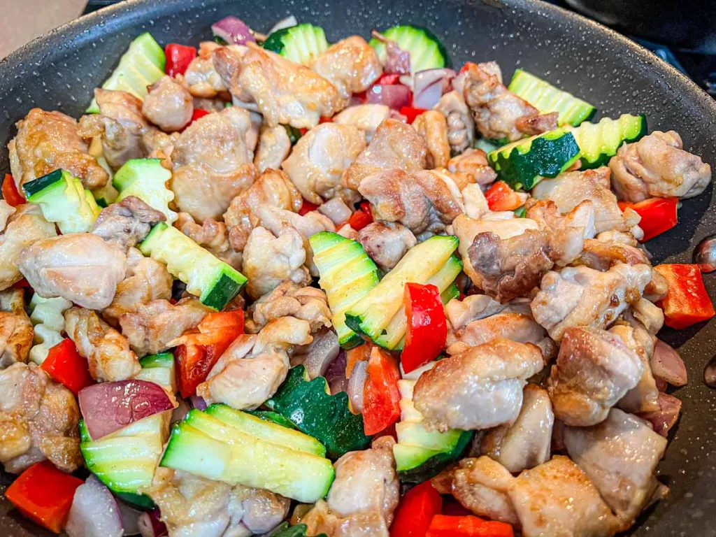 Kung Pao Chicken in a skillet.