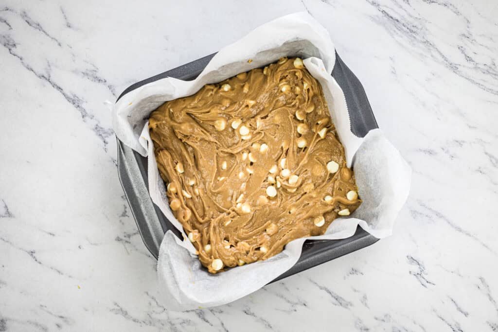 Spread the batter evenly into the prepared baking pan.