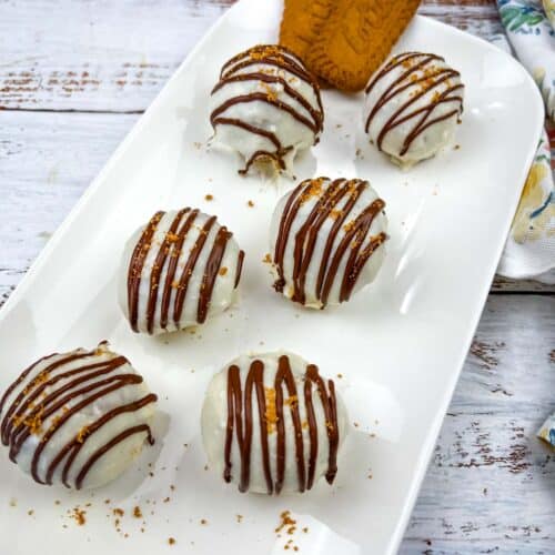 Biscoff Cookie Butter Cake Balls on a white plate.