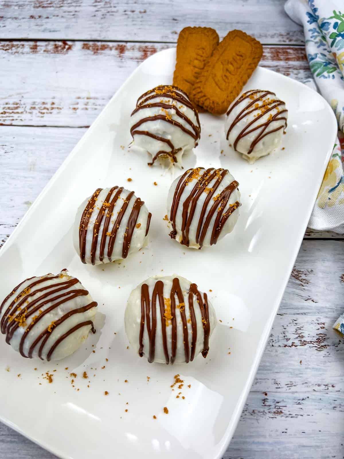 Biscoff Cookie Butter Cake Balls on a white plate.