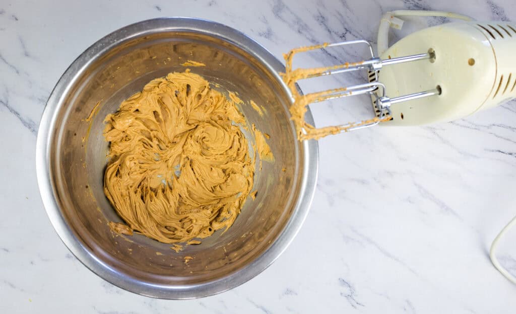 Make the frosting by whipping the cookie butter and butter in a bowl.