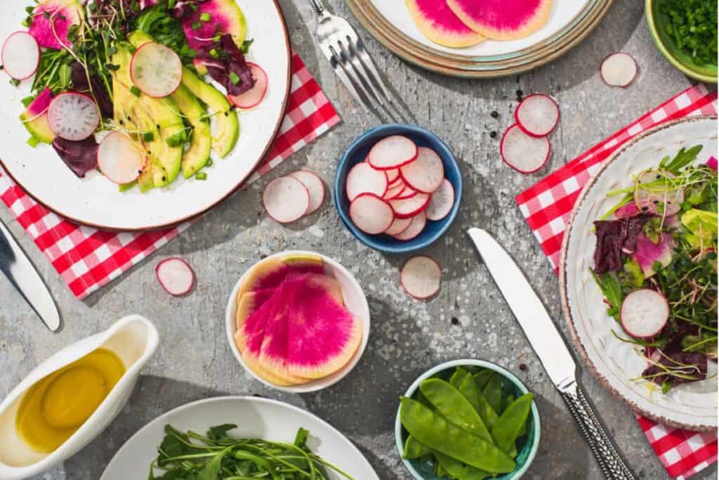 Fresh radish salad with greens and avocado. 