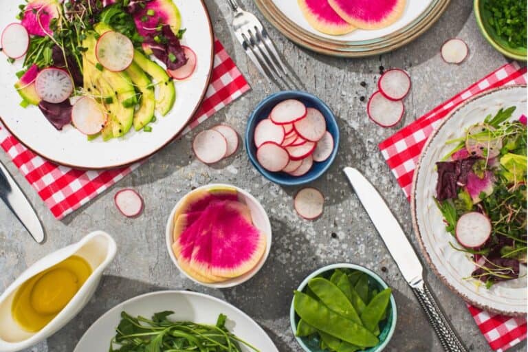 Fresh radish salad with greens and avocado.