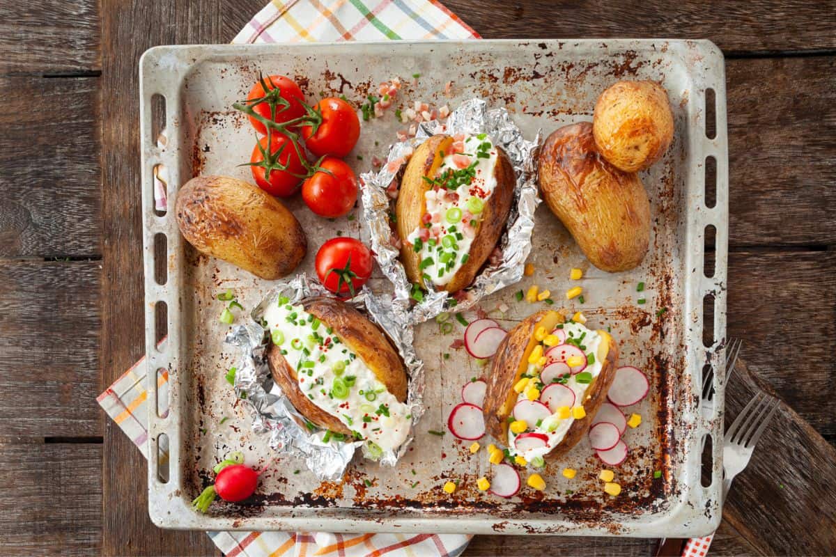 Baked potato with sour cream and fresh herbs.