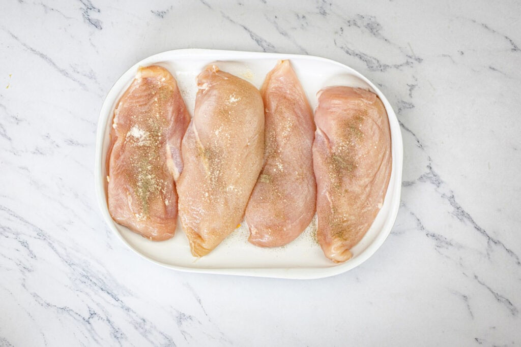 Season the chicken breasts with salt and pepper on both sides.