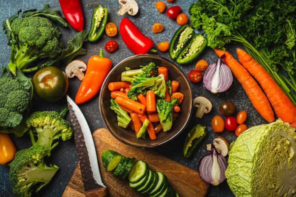 Steamed vegetables on a rustic table.