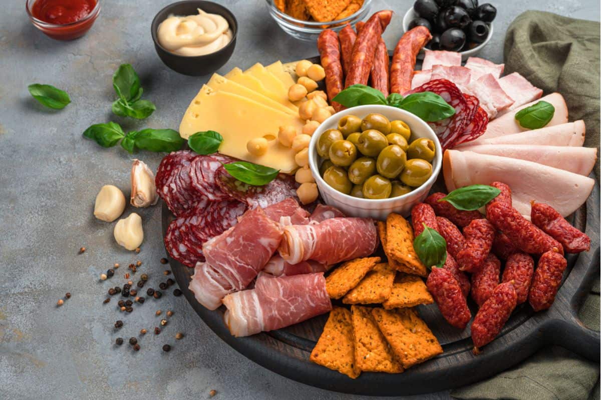 Round Charcuterie board with variety of foods.