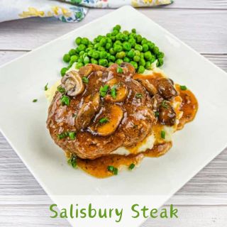 Diner-style Salisbury Steak on a white plate.