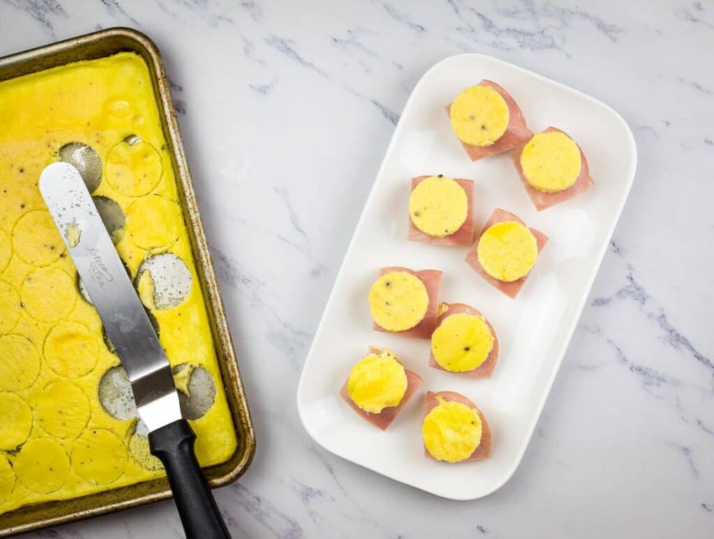 Top each biscuit with a circle of egg.