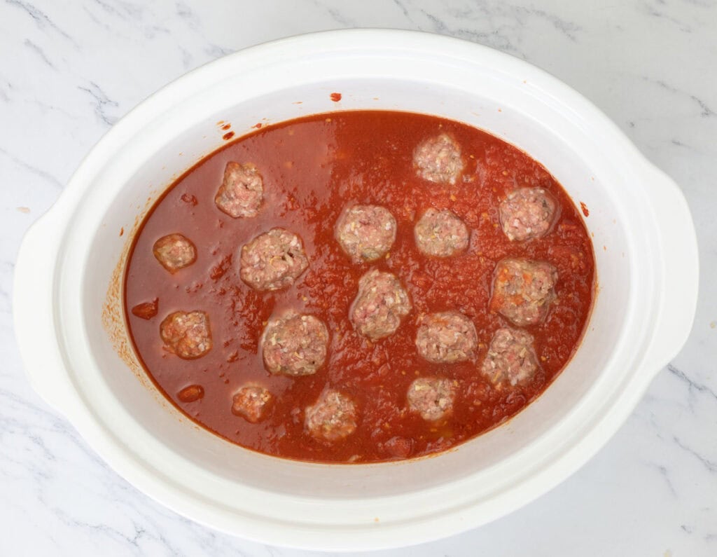 Nestle your meatballs gently into the sauce.