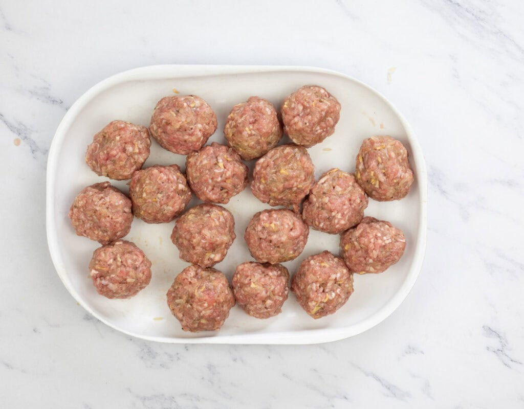Roll the meat mixture into meatballs, about the size of ping pong balls.