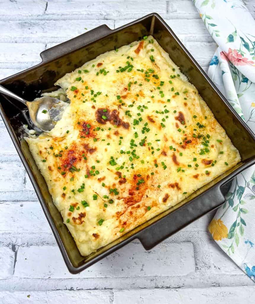 Grandma's Mashed Potato Casserole and spoon.