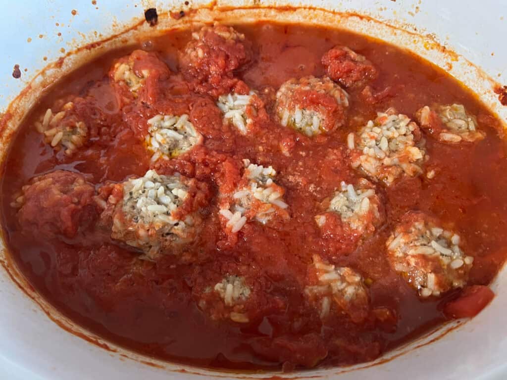Scoop the cooked meatballs out of the sauce.