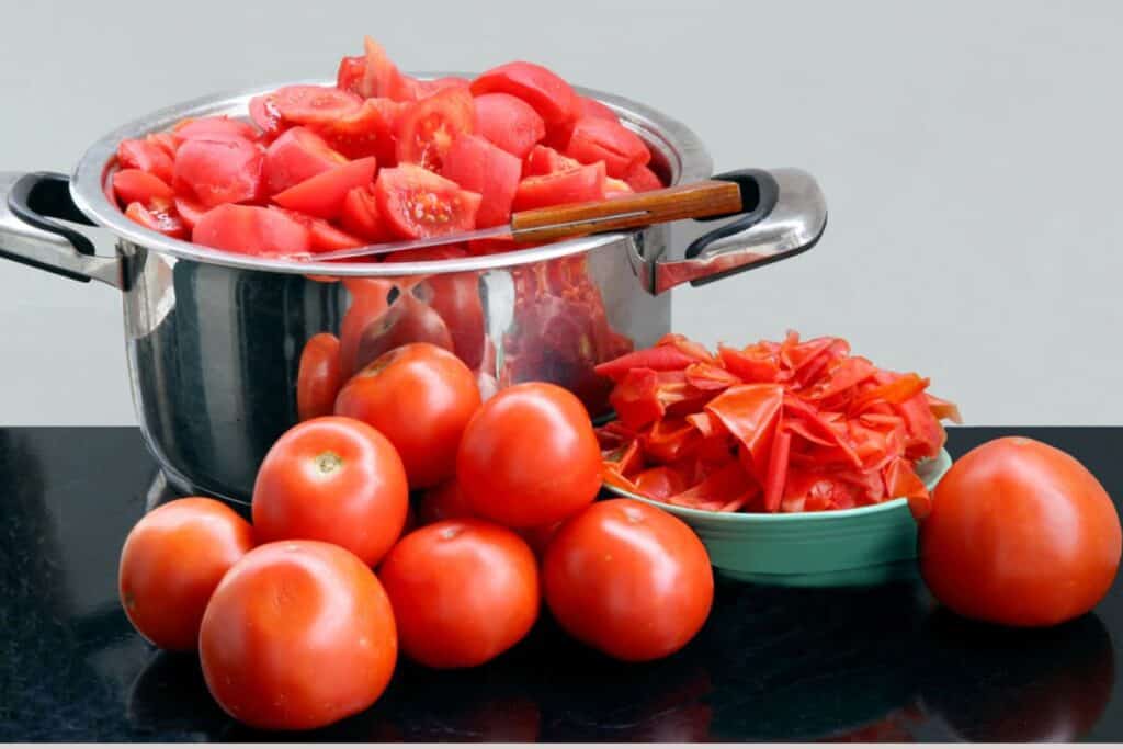 Peeled and cut tomatoes in a big casserole.