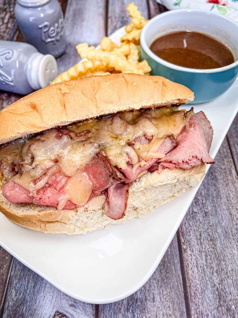 Copycat Cole's French Dip Sandwich on a white plate.