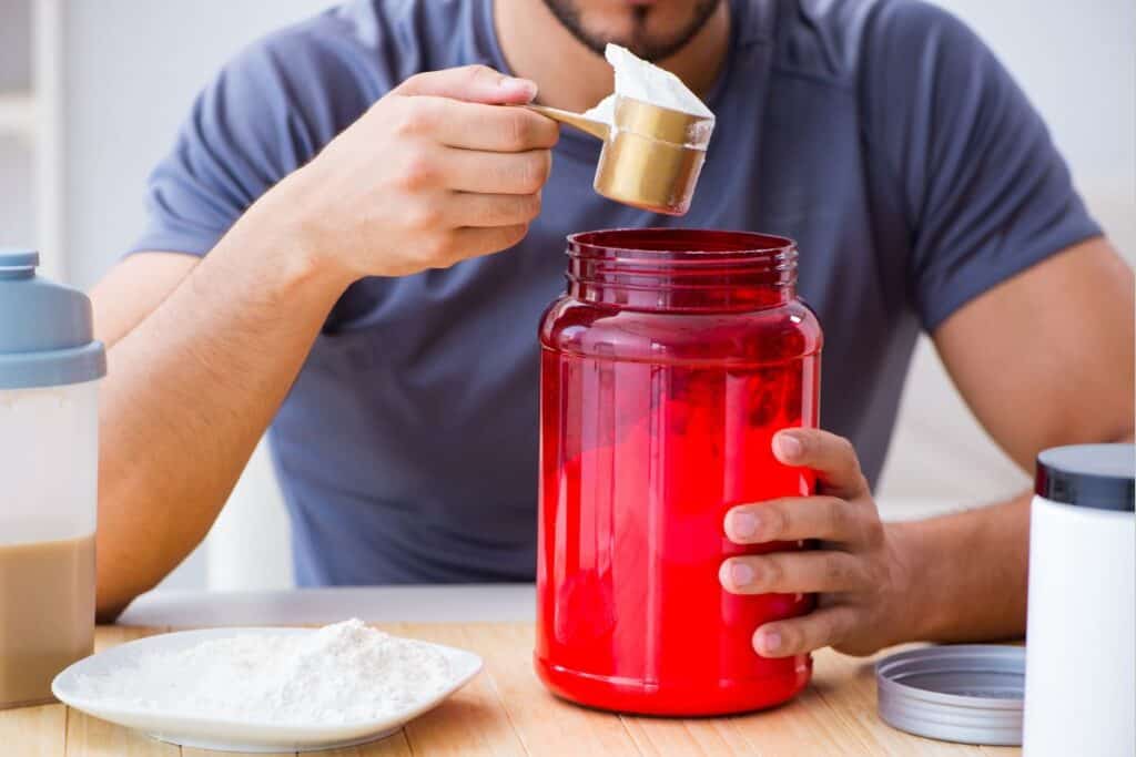 A man preparing his protein drink.