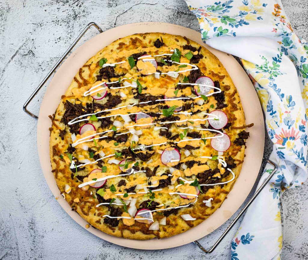 Birria Pizza on a pizza stone