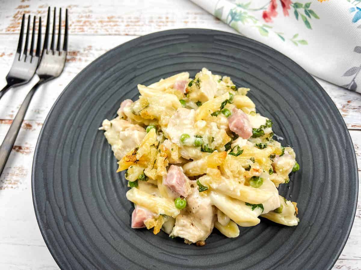 Chicken Cordon Bleu Casserole on a black plate.