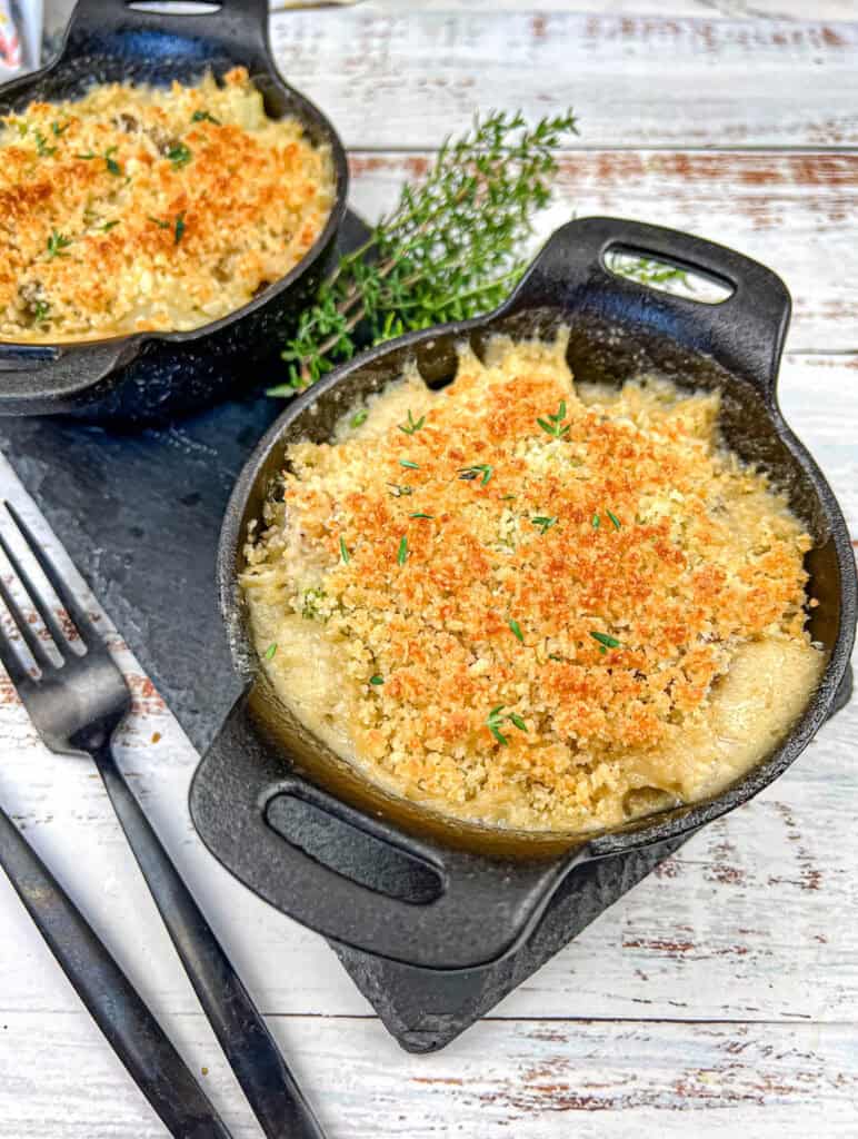 Chicken divan on a black bowl.