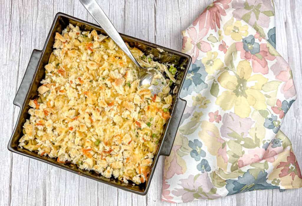 Top-down shot of Classic Tuna Noodle Casserole beside napkin.