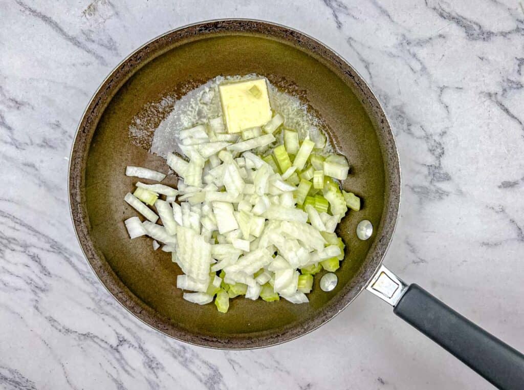 Add the diced onion and celery, and cook until they are soft.