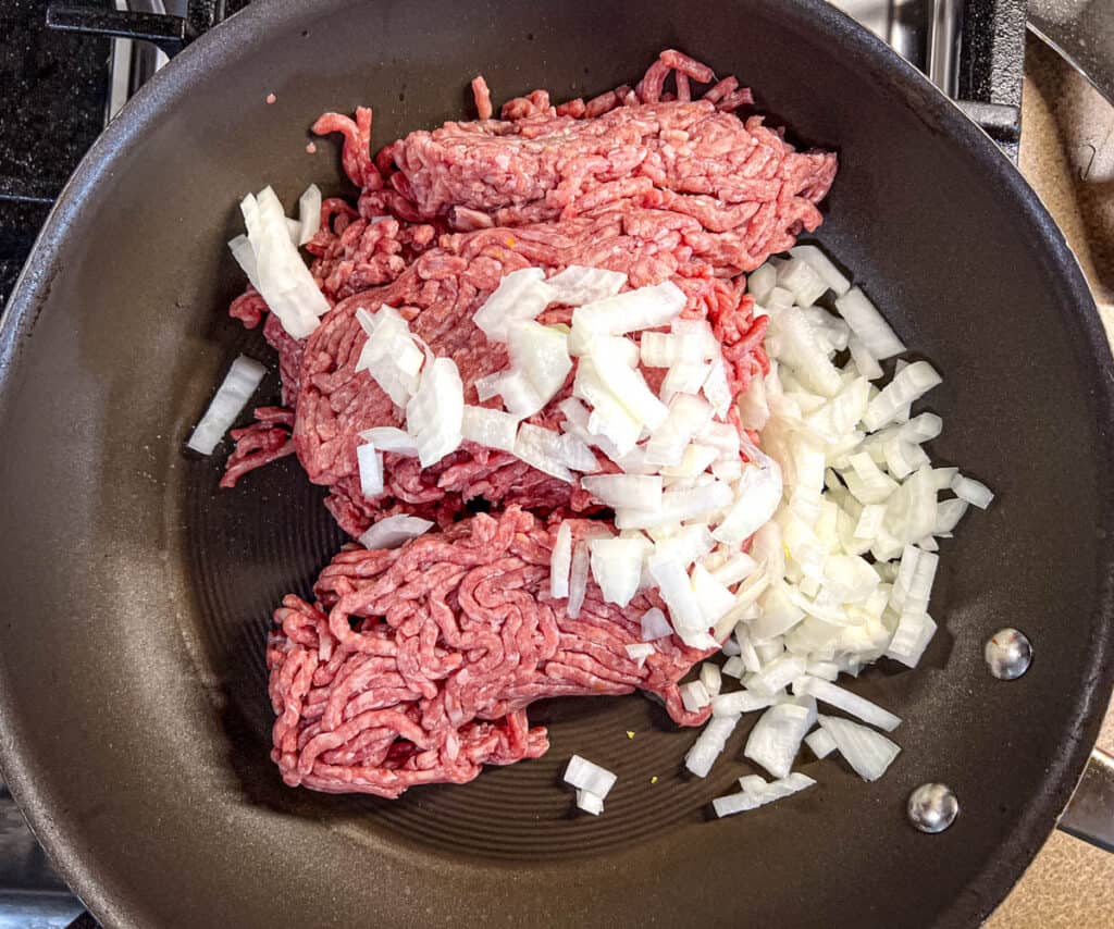 Cook the ground beef and onion in a large skillet