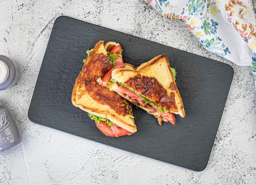 Top-down shot of Texas BLT on a slate plate.