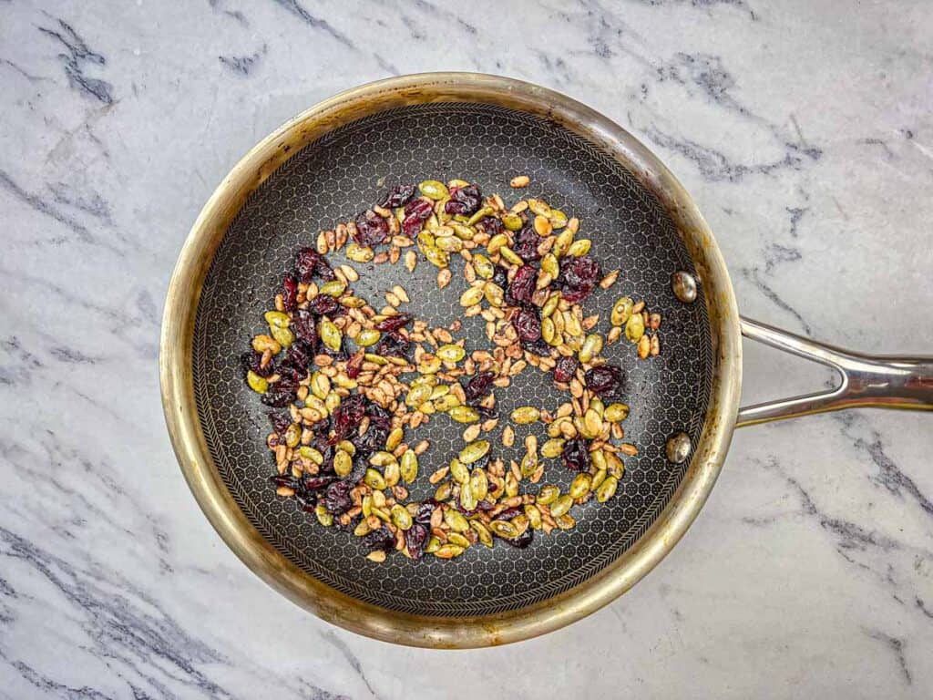 Stir in seeds, pumpkin spice, salt, and cranberries.