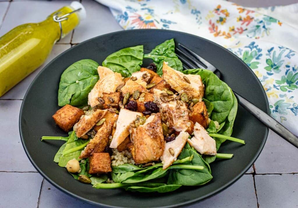 Salmon bowl on a black plate.