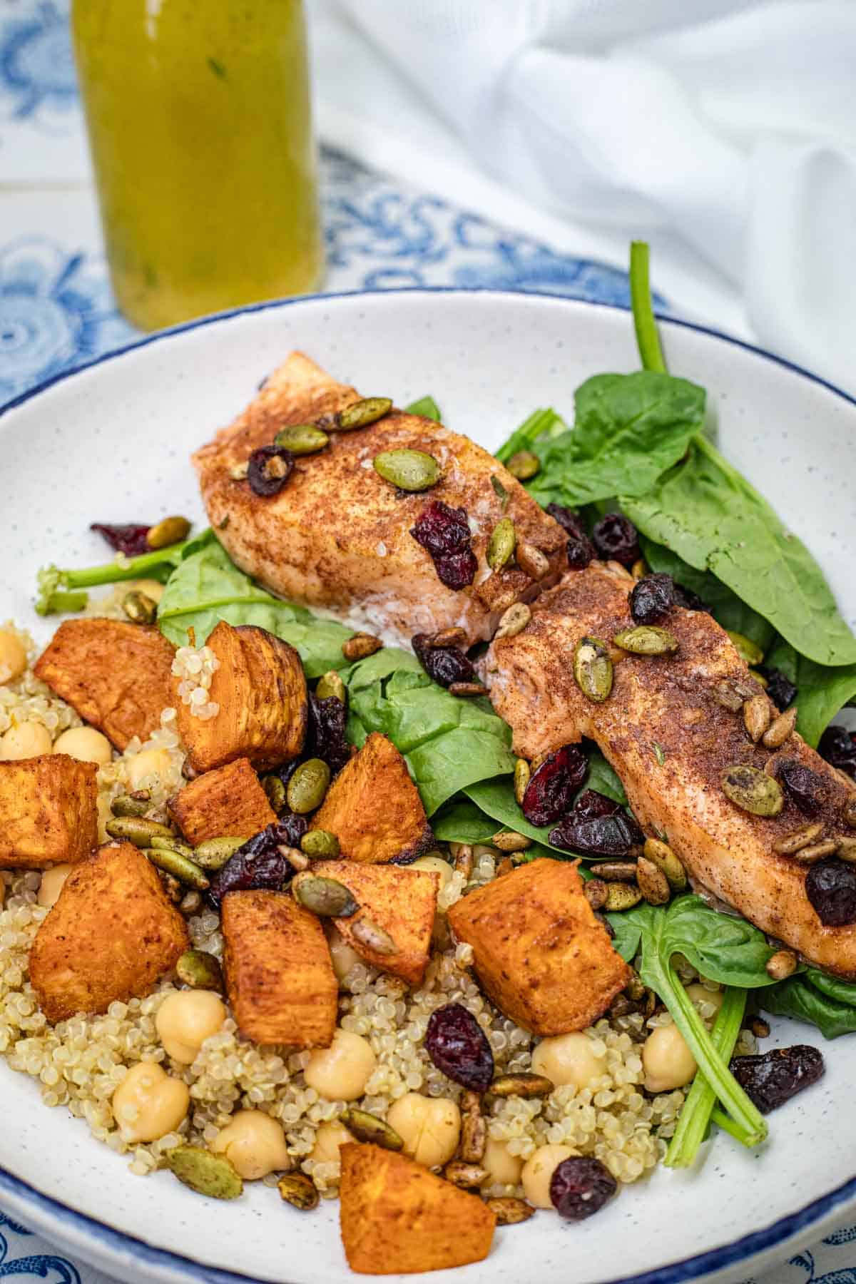 Salmon bowl on a white and blue plate.