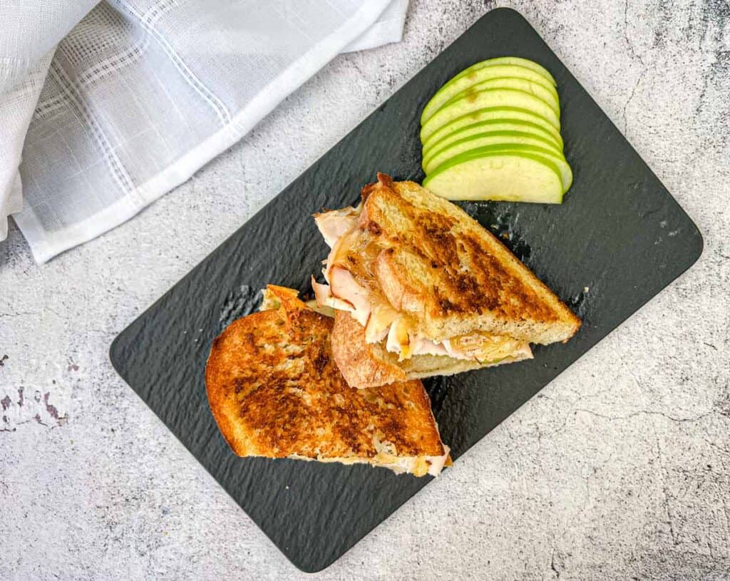 Top-down shot of Turkey & Apple Grilled Cheese on a plate.