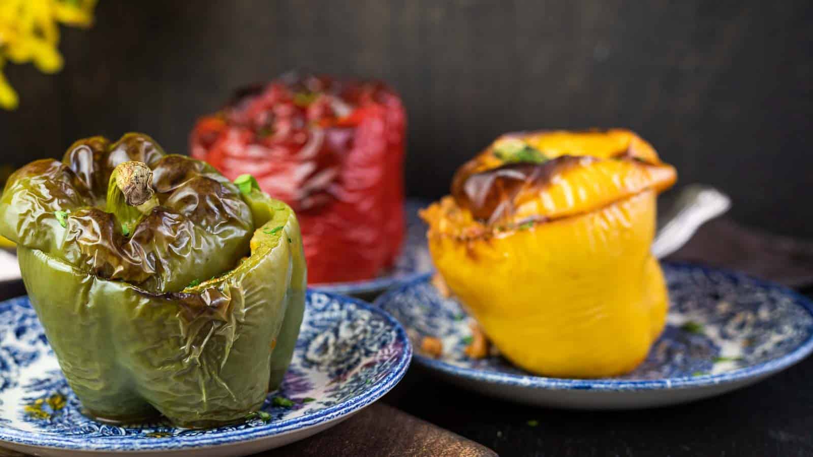 Stuffed bell peppers on a blue plates.