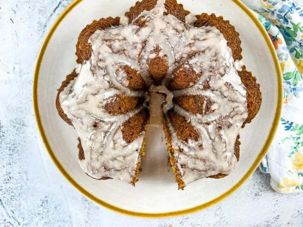 Pumpkin Chocolate Cake on a white circular plate with gold rim.