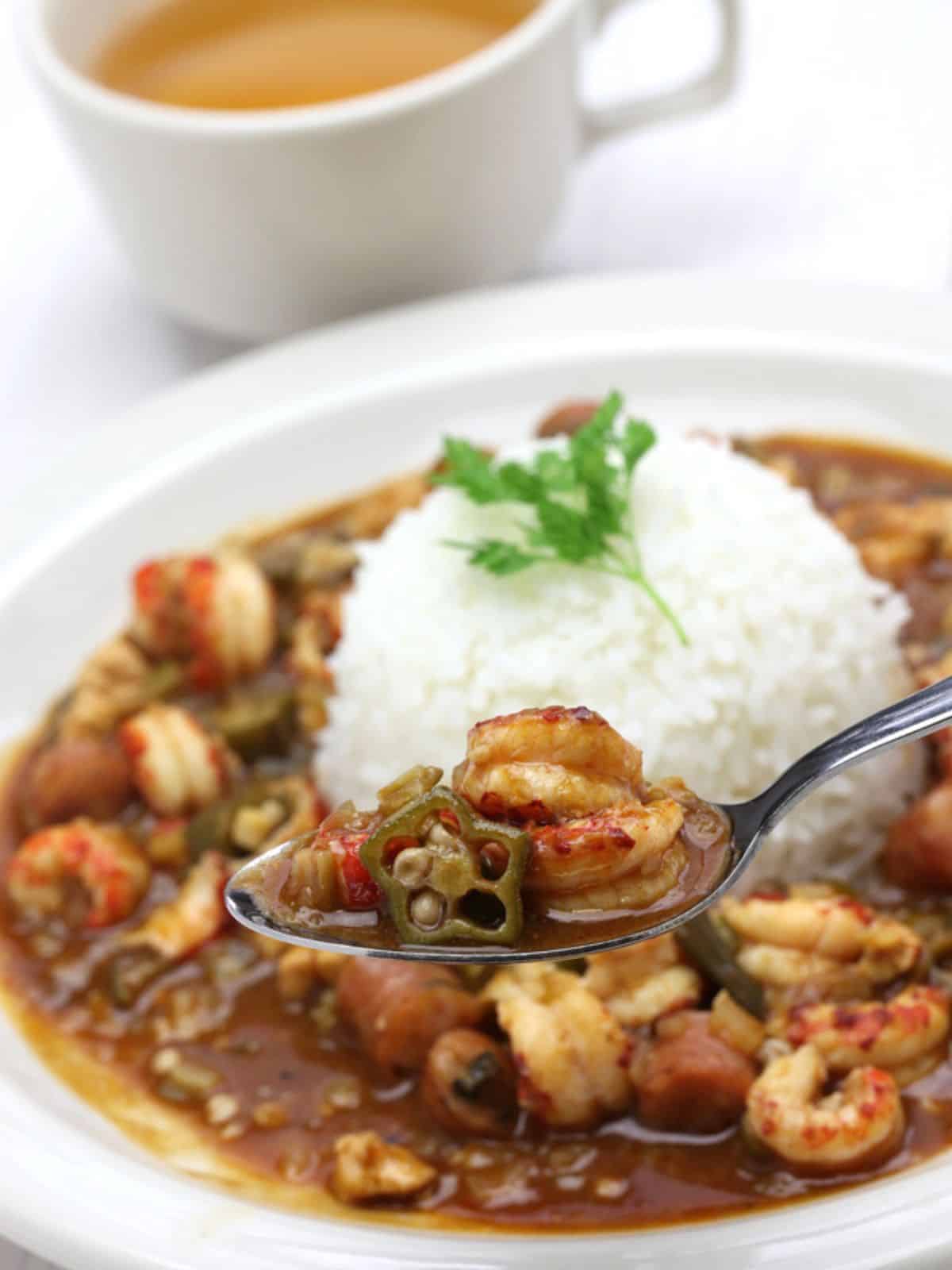 Gumbo a Southern Food on White Plate with Coffee.