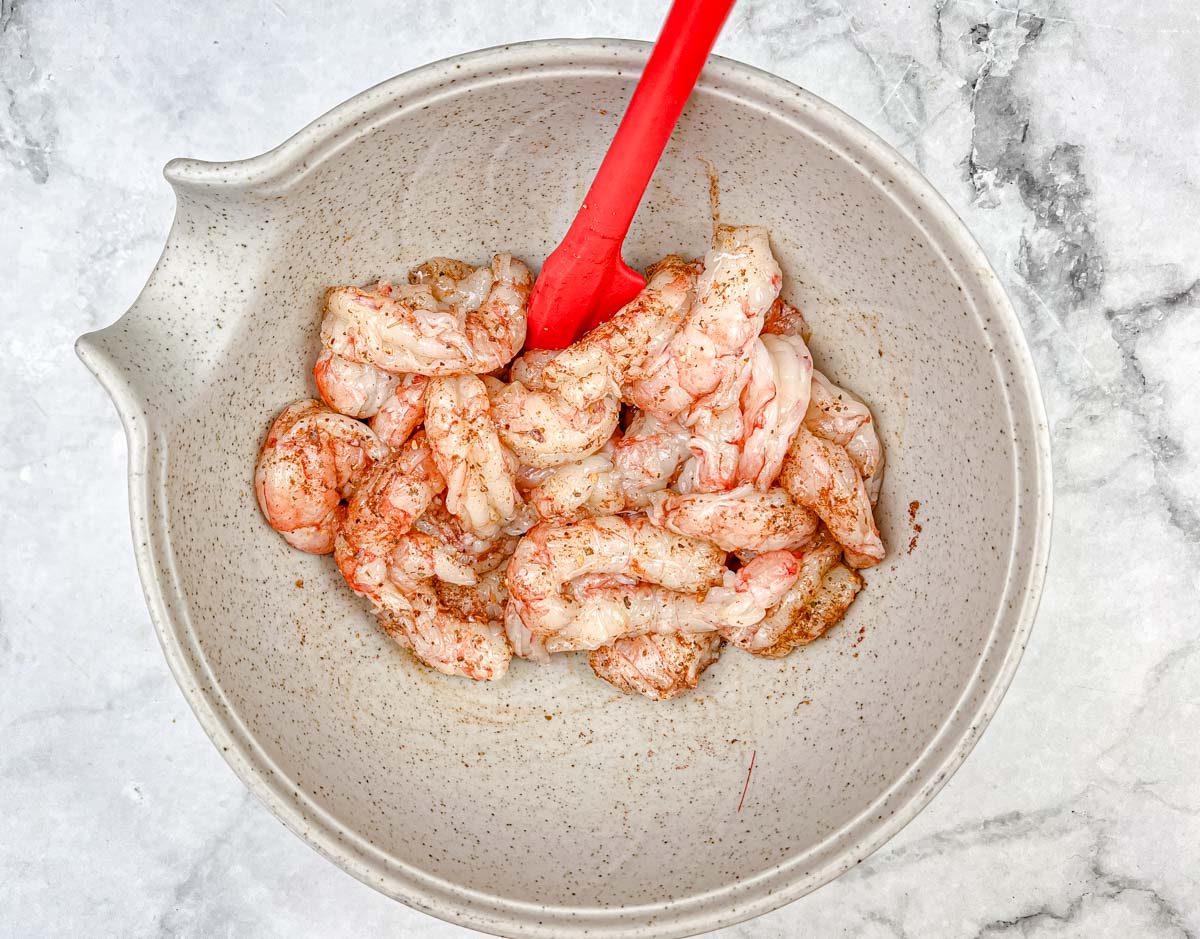 Toss the shrimp with 1 tablespoon of Cajun seasoning.