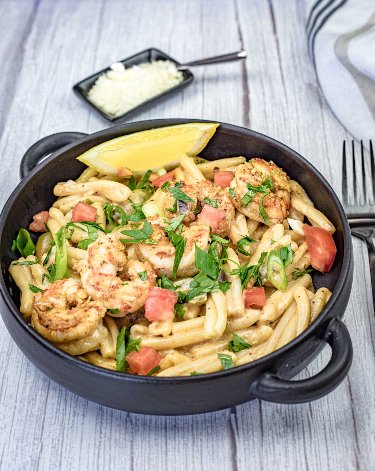 Cajun Pasta with Shrimp on a black skillet.