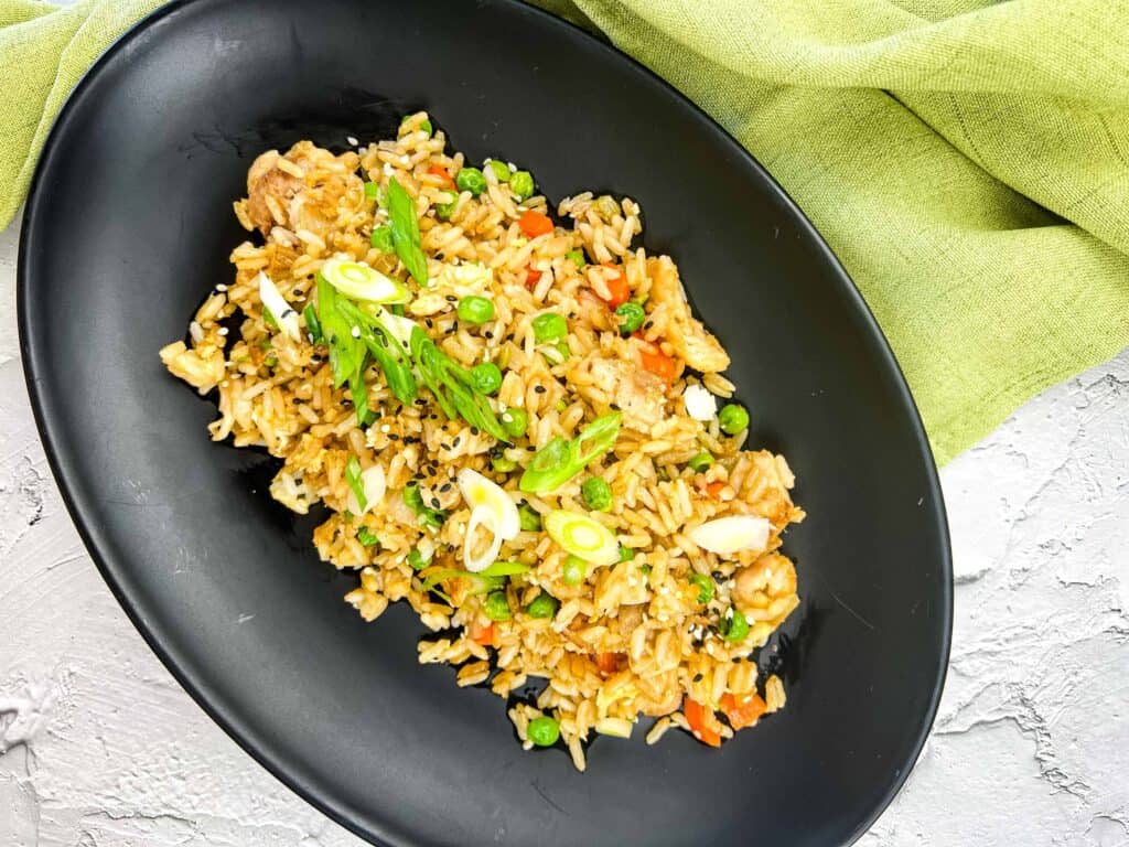 Top-down shot of Turkey Fried Rice on a black plate.