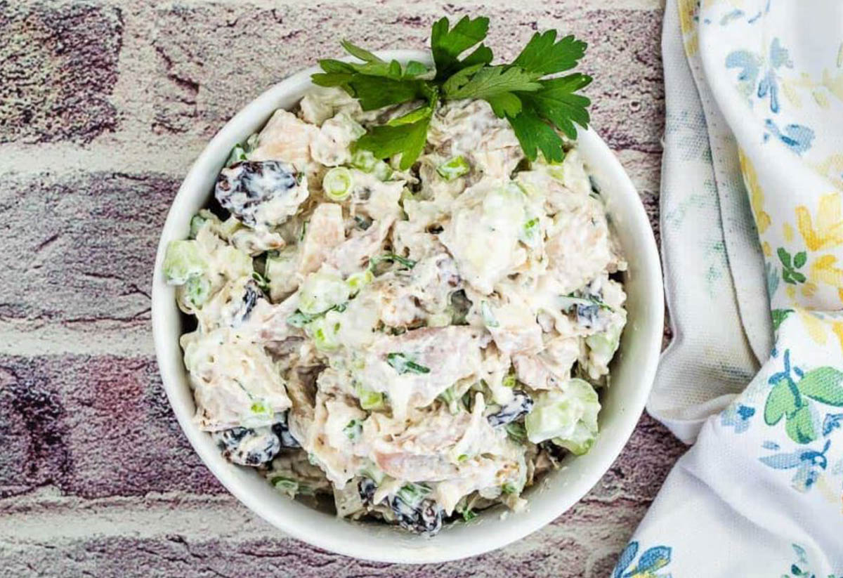 Top-down shot of Turkey Salad with Cranberries & Walnuts on a bowl.