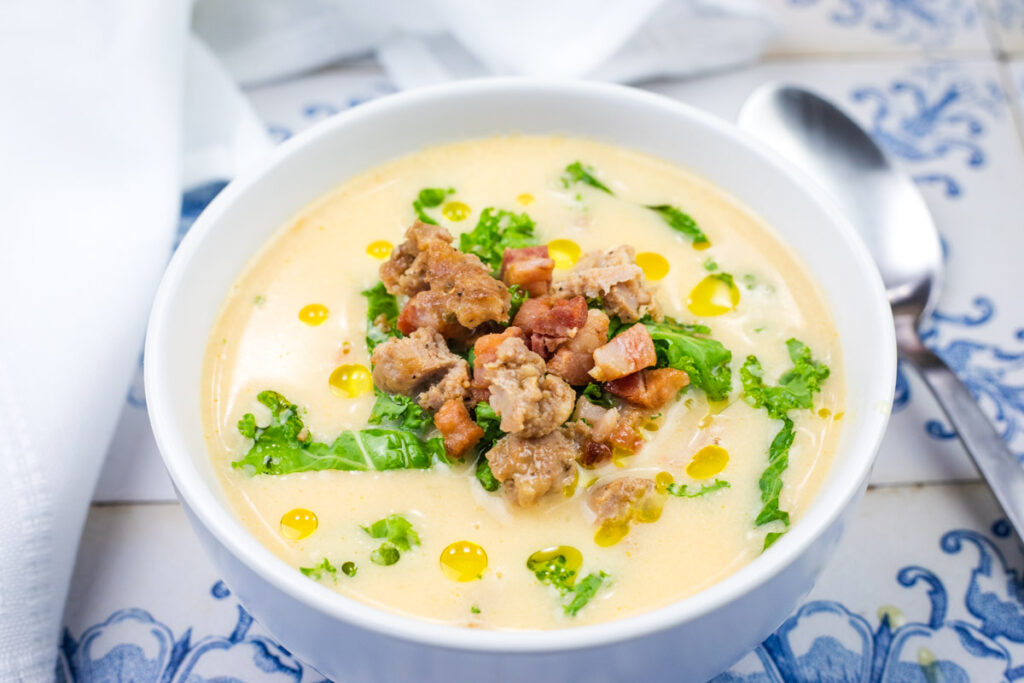 A bowl of Creamy Tuscan Soup With Sausage & Kale.