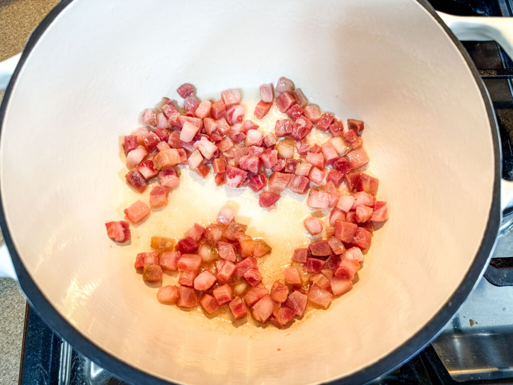 Cook the pancetta until fat is rendered.
