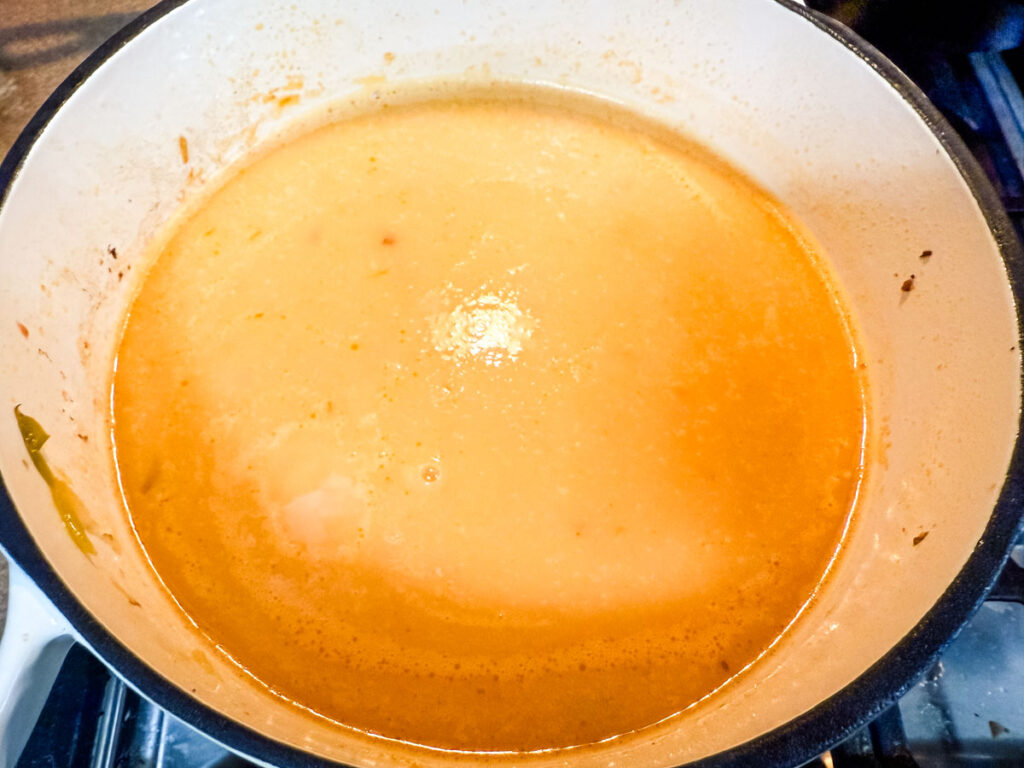 Add the cut potatoes, chicken broth, and tomatoes. Blender and blend until puree.