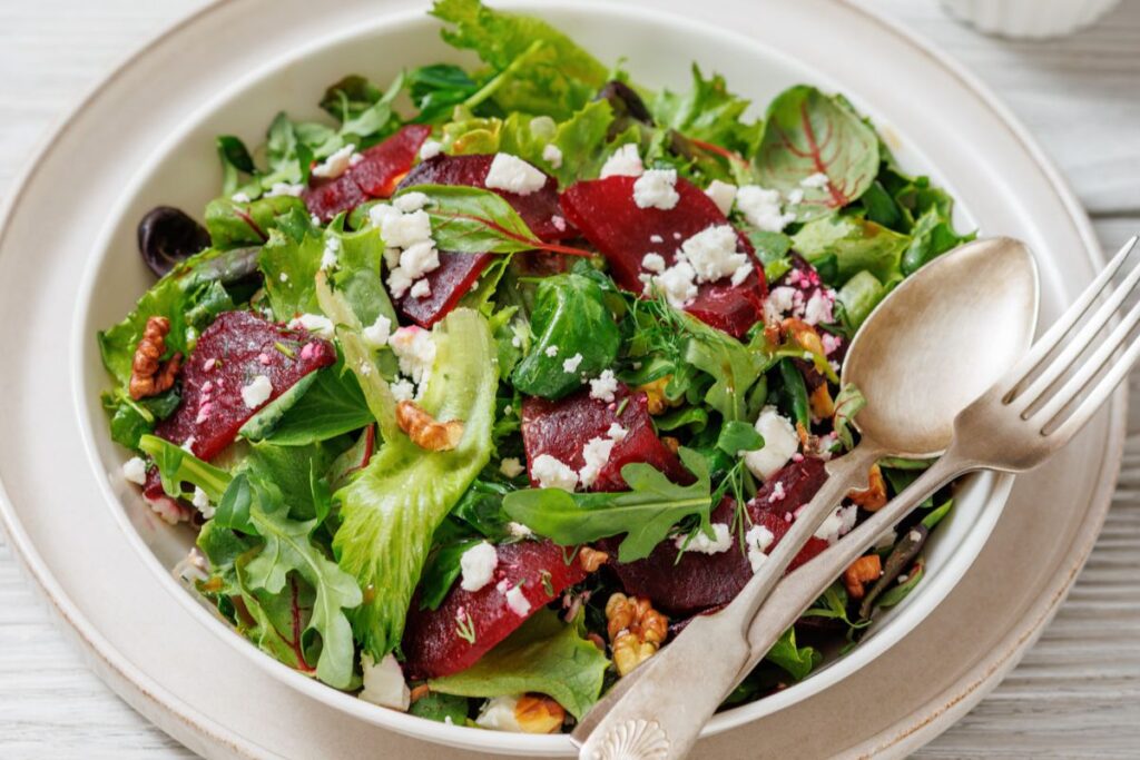 A bowl of Beet Salad with Goat Cheese & Walnuts.
