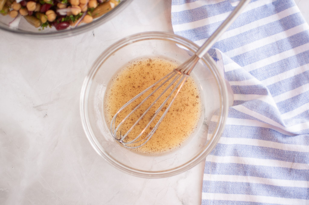 Whisked apple cider vinegar, olive oil, honey, Dijon, salt, and pepper.