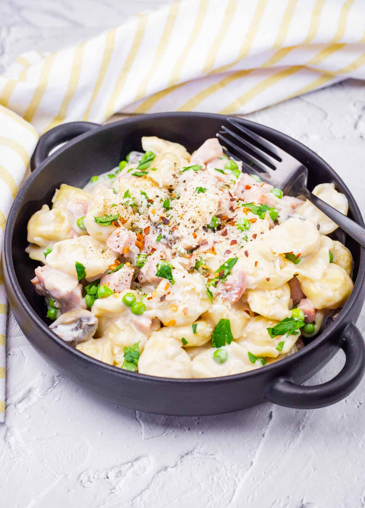 Photo of a Skillet Cheese Tortellini with Ham & Peas.