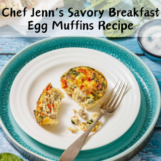 A breakfast egg muffin sits on a white plate with a blue border, partially eaten with a fork resting beside it on a blue wooden table.